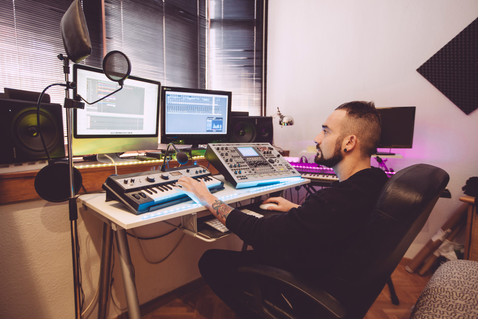 keyboard professional operator mixing tracks in an audio editing program
