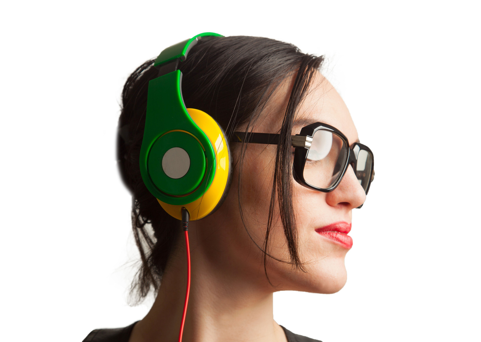 Young Woman wearing Black Large Framed Glasses and Listening to Headphones