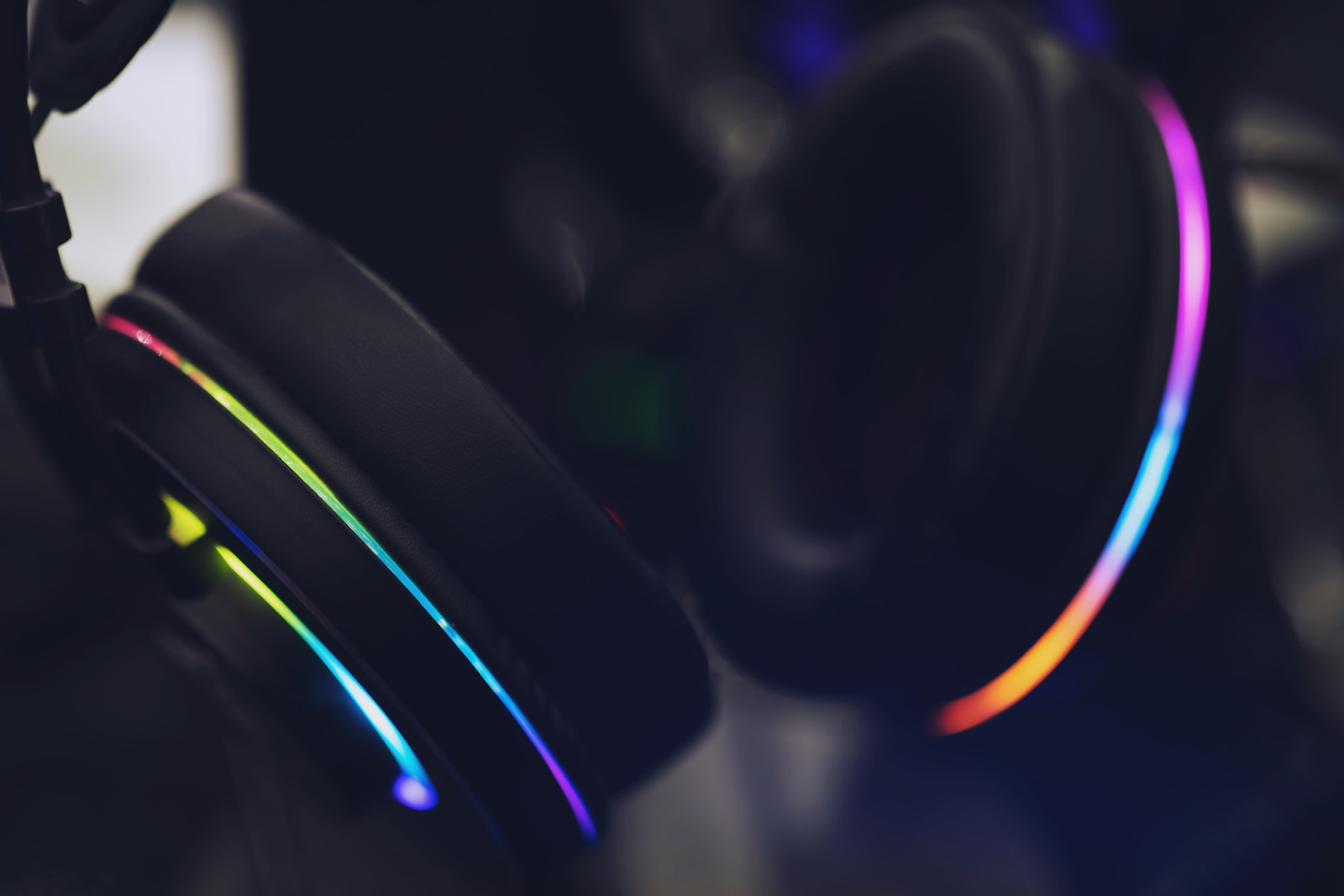 Close up of Computer RGB gaming headphones, Illuminated by colored LED