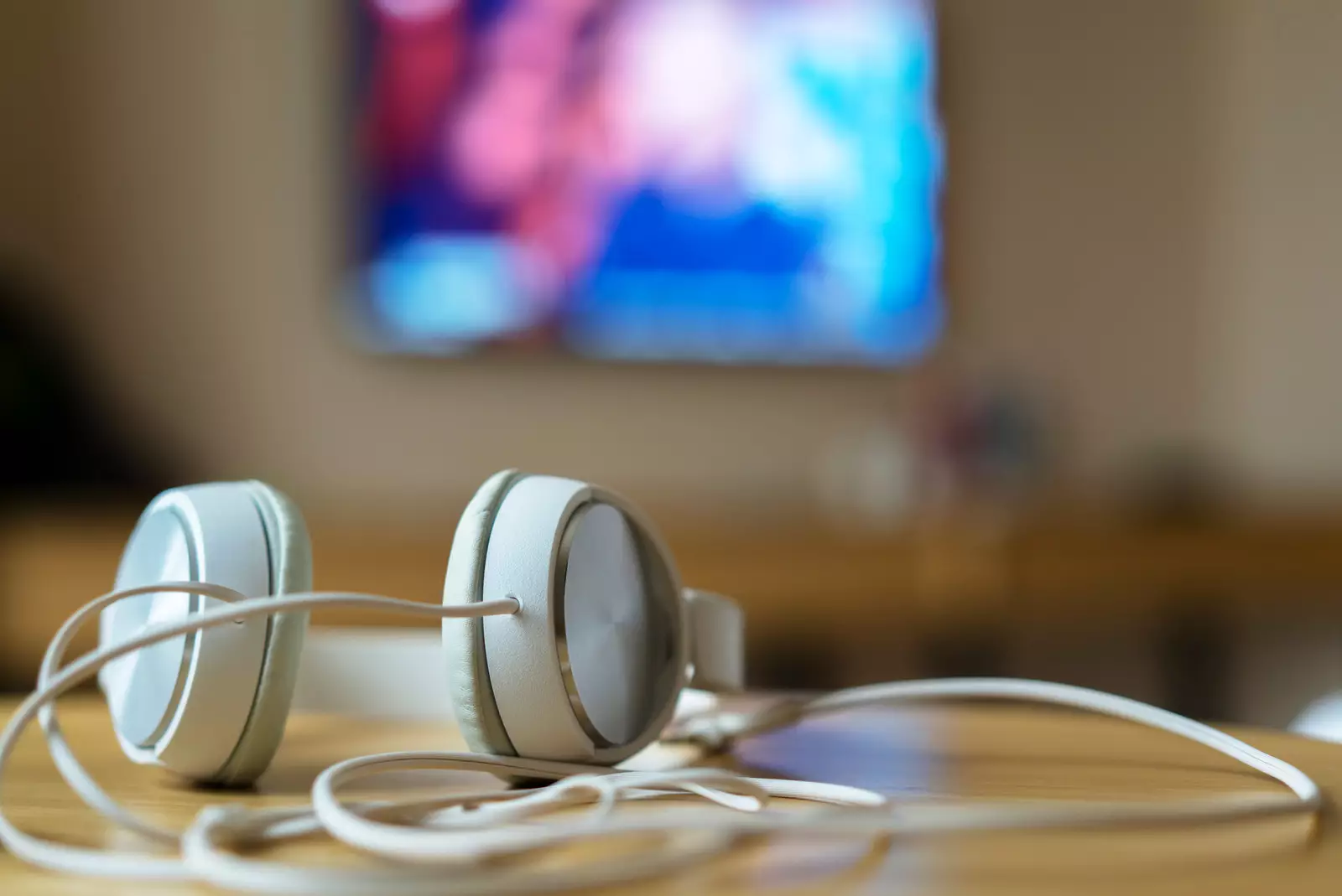 headphone on table, watching TV