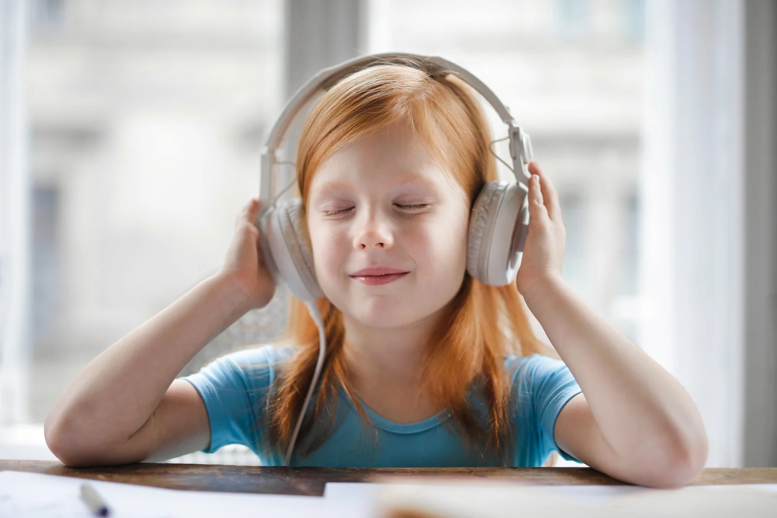 happy kid using a headphone